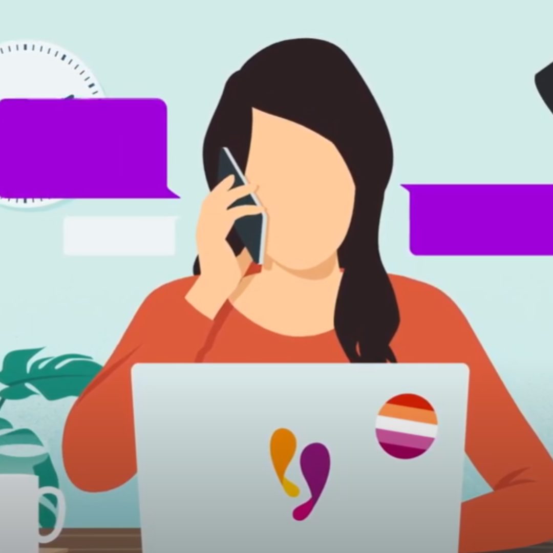 Illustration of a woman holding a phone to her ear while sitting at a laptop with the Live Fear Free Helpline logo on it. 